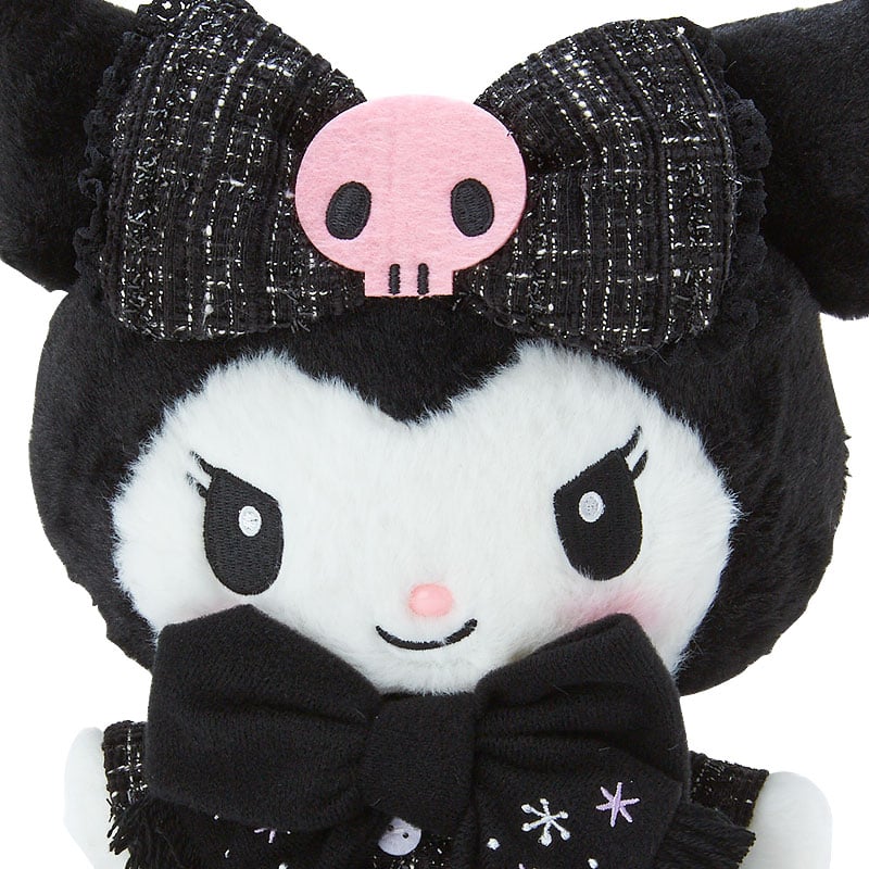 Kuromi 9-inch plush lying on a cozy blanket, showcasing its adorable winter-themed design