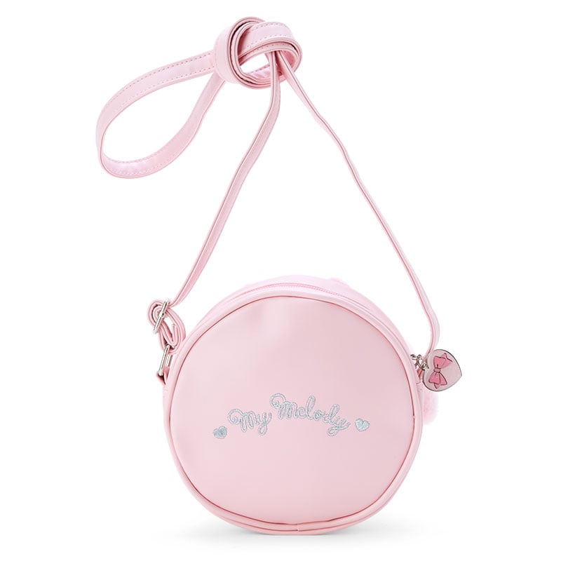 Close-up of heart-shaped zipper pull on My Melody bag.