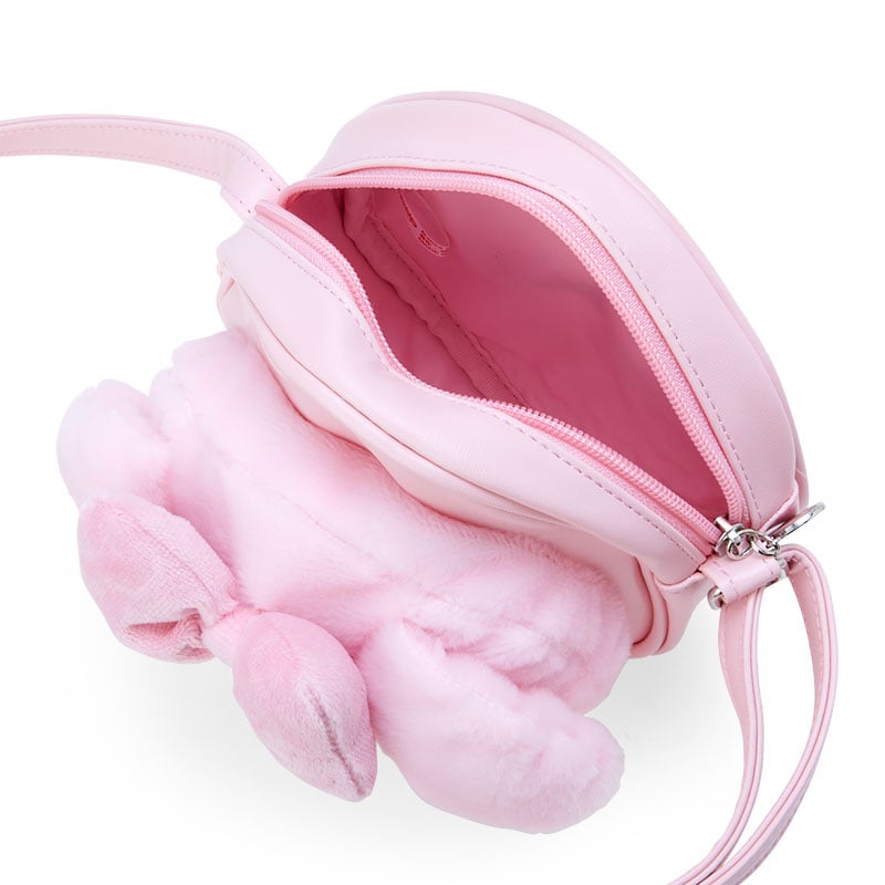 Side angle of My Melody plush bag on a stylish outfit.