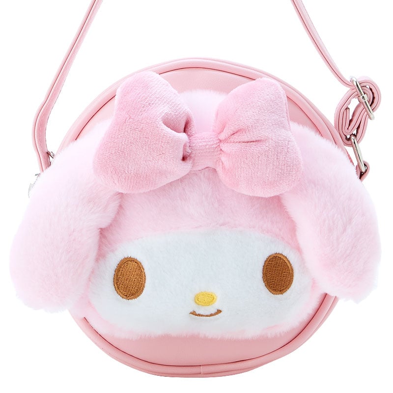 Side angle of My Melody plush bag on a stylish outfit.