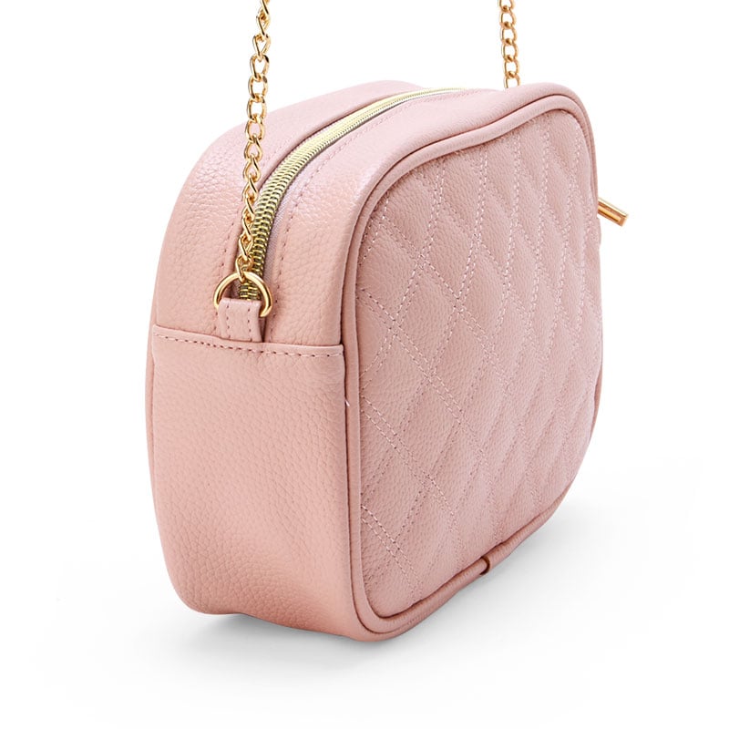 Detailed view of gold hardware and embroidered Sanrio character