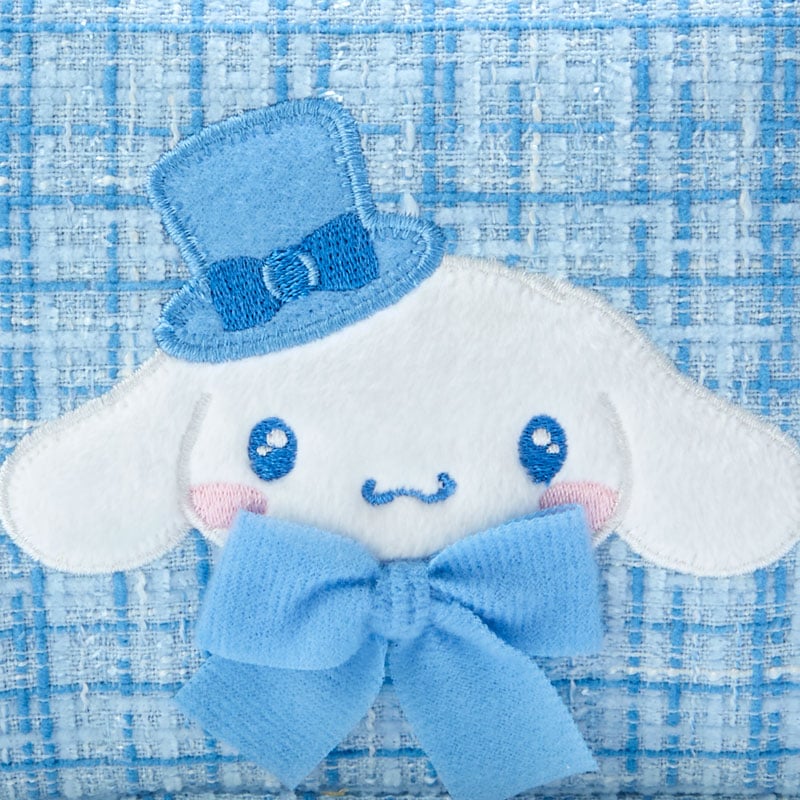 Front view of winter tweed mini pouch showcasing Cinnamoroll embroidery and pearl zipper
