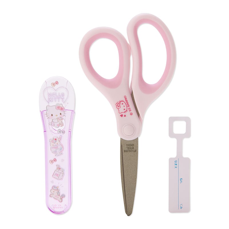 Close-up of craft scissors featuring rounded edges and a protective cover.
