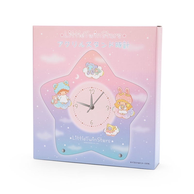 Close-up of the Kiki and Lala star-shaped desk clock with fluffy cloud caps