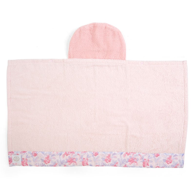 Baby wrapped in the My Melody towel, smiling with the character hood up