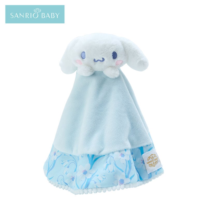 Close-up of the embroidered face on the Cinnamoroll plush lovey with knotted ends