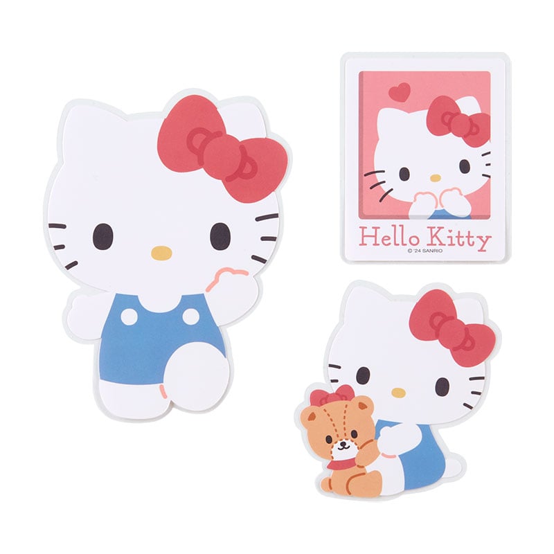 Person applying a Hello Kitty sticker to a phone case for personalization