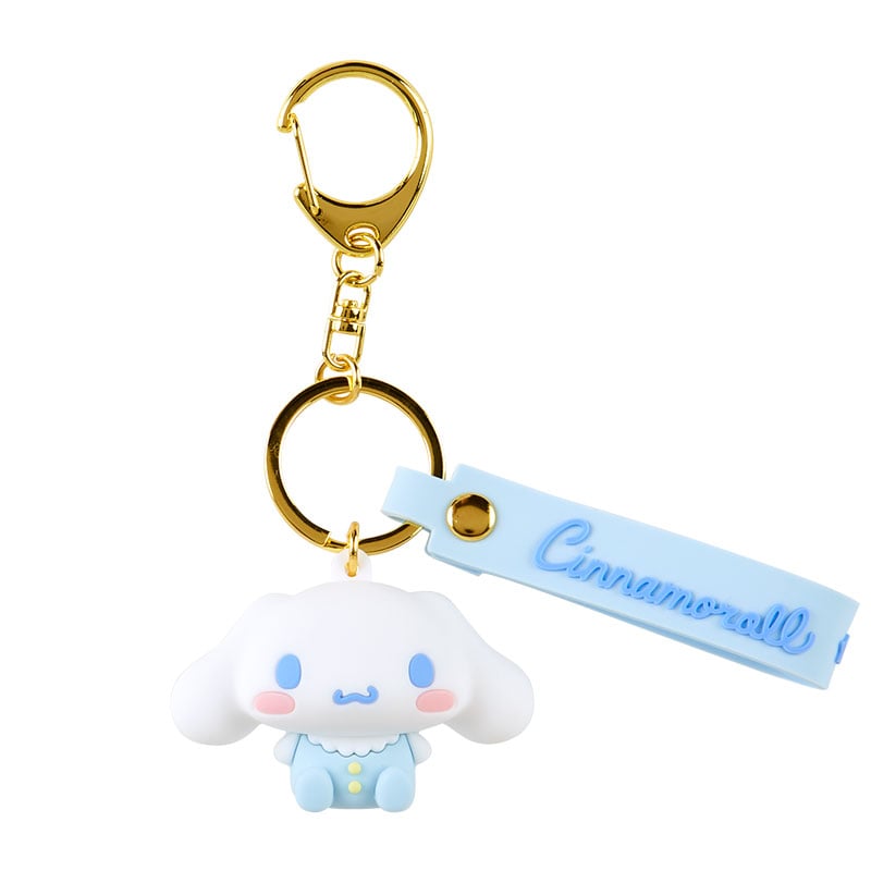 Cinnamoroll Baby Series keychain displayed on pastel pink background