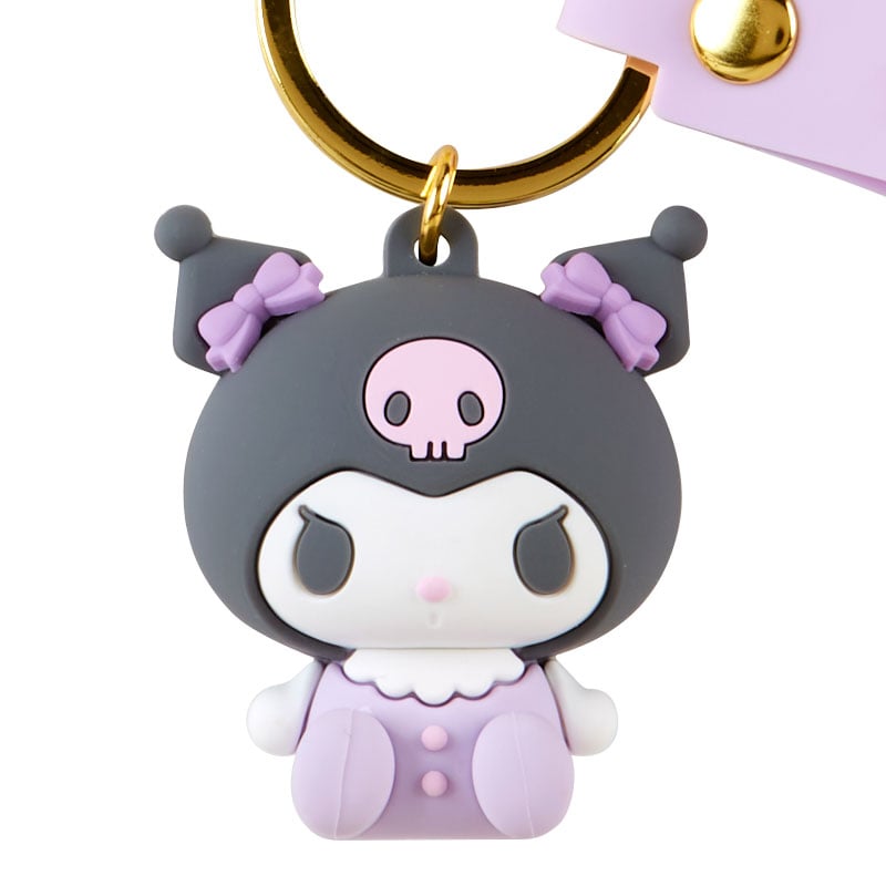 Side view showing custom keychains attached to colorful backpack