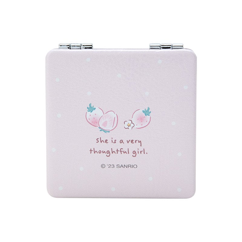 Close-up of the Hello Kitty compact mirror showing both magnification and standard sides