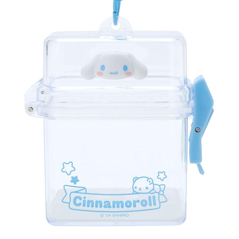 Sanrio merchandise Cinnamoroll case attached to a backpack during a day out in the city