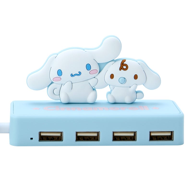 The Cinnamoroll mini USB hub connected to a laptop, displaying its compact size and style