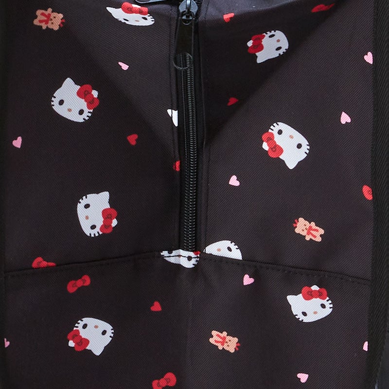 Hello Kitty mesh tote bag in use for laundry storage, showing its spacious interior