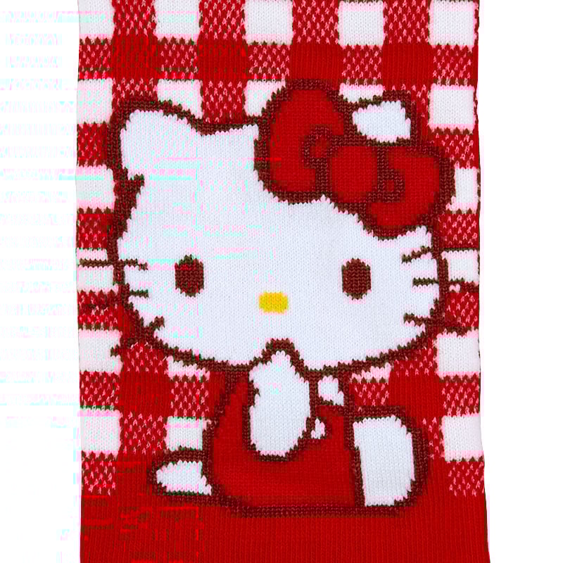 Close-up of the Hello Kitty face knitted into the checkered design