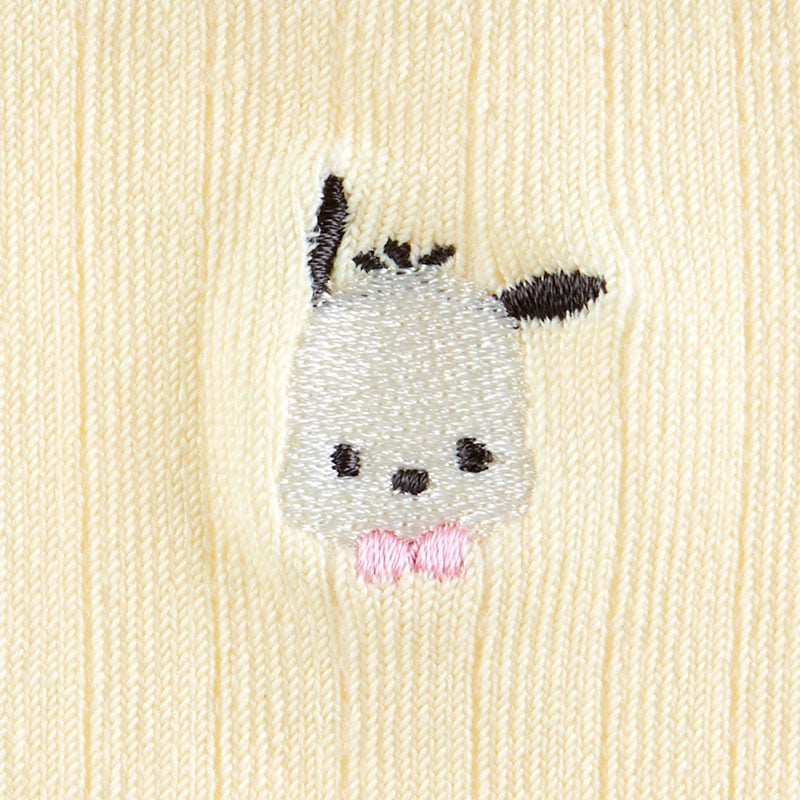 Side view of Pochacco socks paired with stylish sneakers.