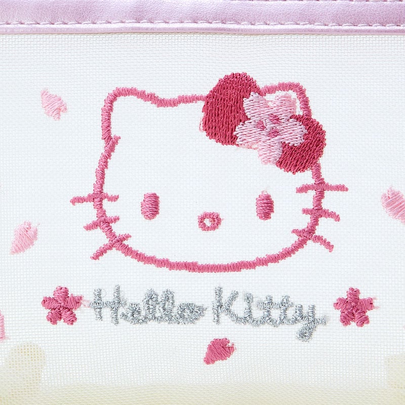 Front view of Hello Kitty cosmetic pouch with zipper pull and floral accents