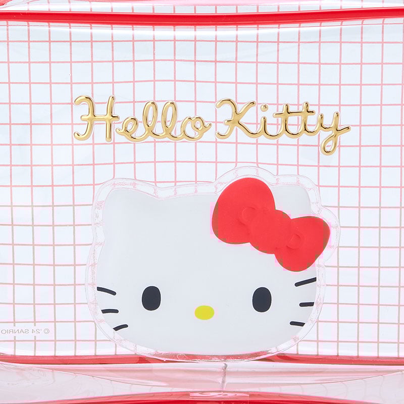 Hello Kitty clear zipper pouch filled with cosmetics and placed in a handbag