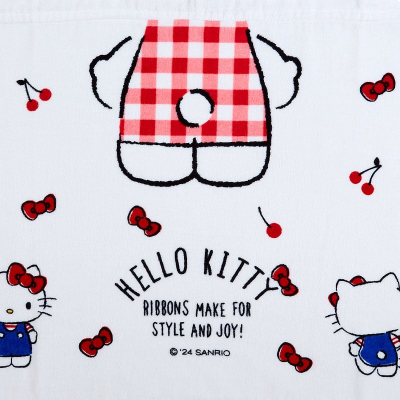 Kids wearing a Hello Kitty cherry hooded towel after bath time, showing the character applique and snap closure