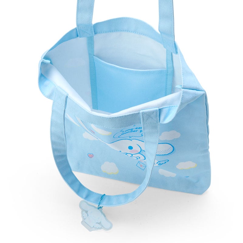 Side angle showing the spacious interior and internal pocket of the cute tote bag