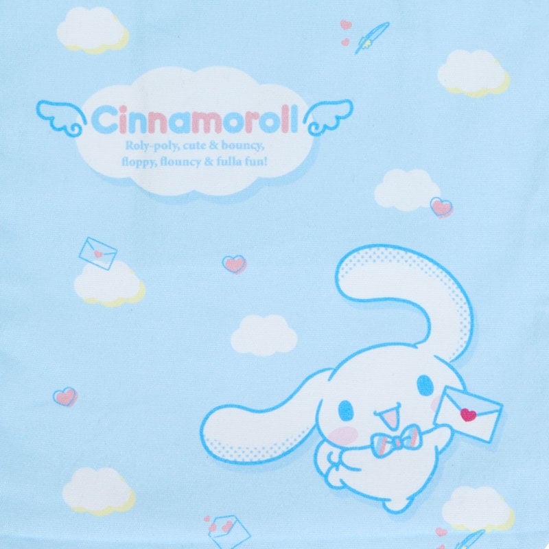 Close-up of the detachable Sanrio charm and letter-themed print