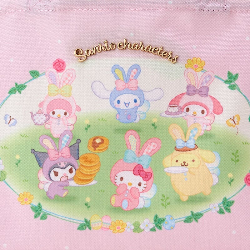 Close-up of Sanrio characters tote bag showing bunny costumes and front plate detail