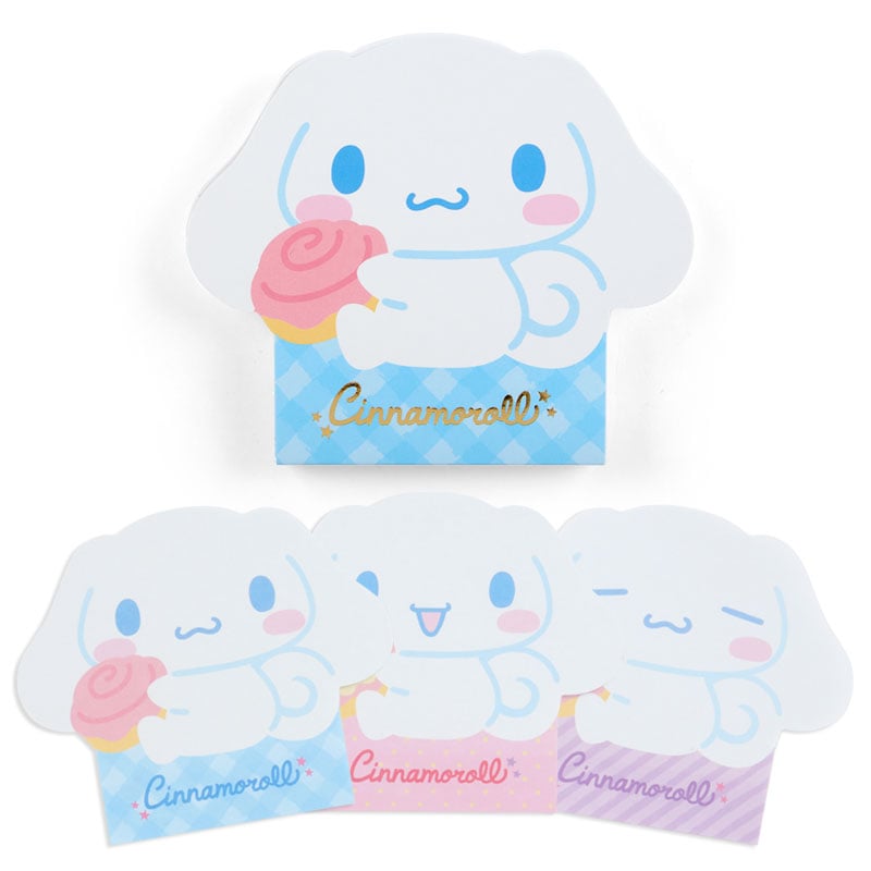 Close-up of die-cut memo pad sheets with cute expressions