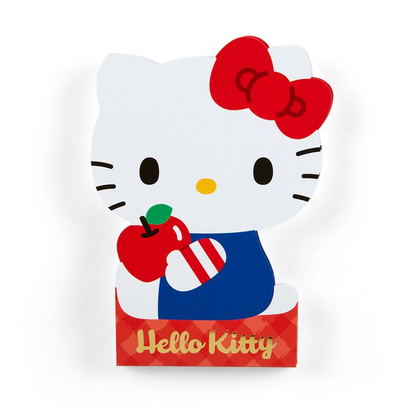 Hello Kitty die-cut memo pad on a desk with colorful stationery