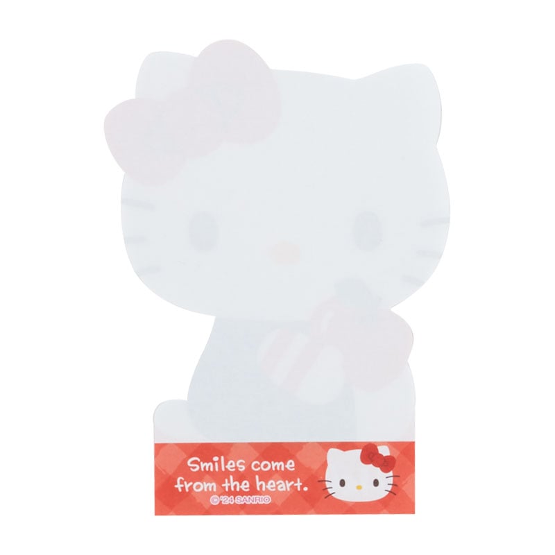 Desk setup with Hello Kitty memo pads and other stationery Sanrio items.