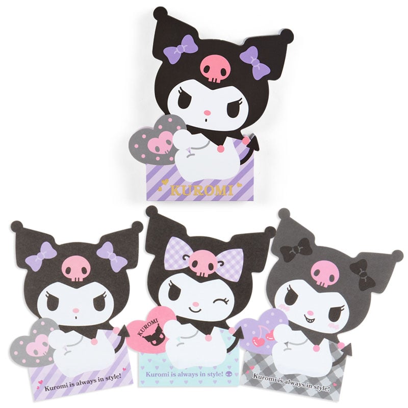 Close-up of Sanrio memo pad sheets showing three playful Kuromi faces