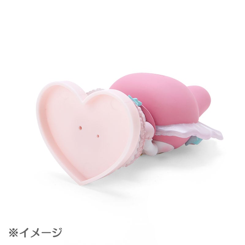 Close-up of the Hello Kitty figurine with a removable base.