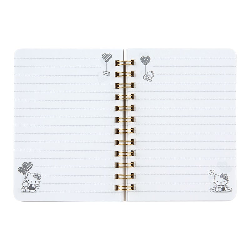 Closeup of spiral binding and ruled pages from the Hello Kitty notebook