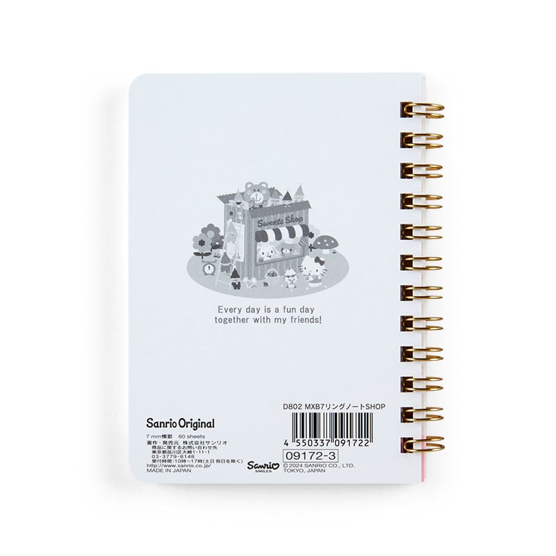 Close-up of Sanrio characters on compact spiral notebook with colorful cover