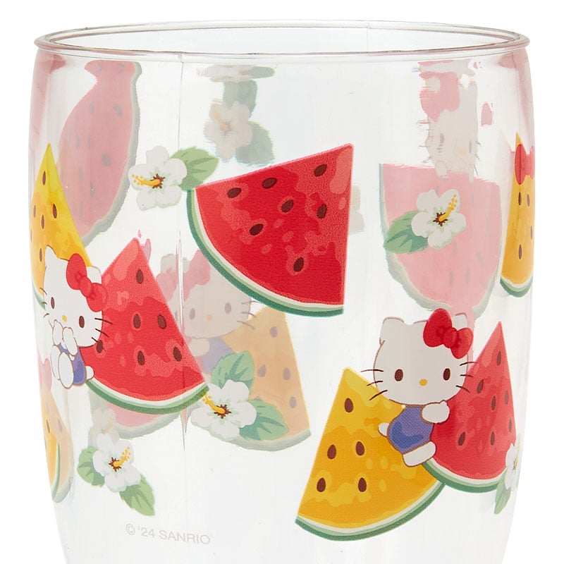 Acrylic tumbler with Hello Kitty design being washed with a sponge
