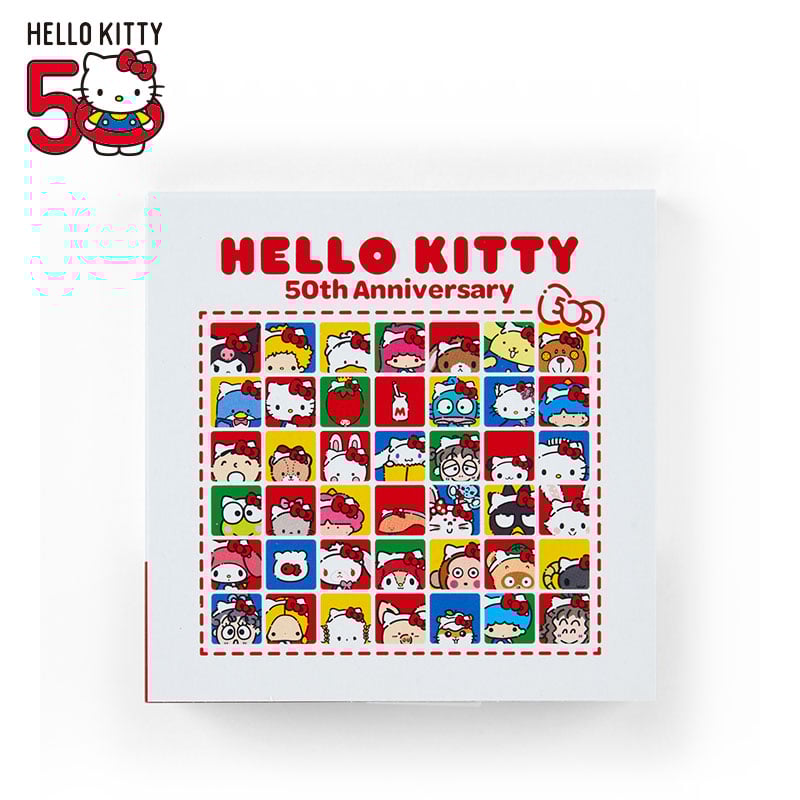 Front view of Hello Kitty 50th anniversary memo pad with red bow design.