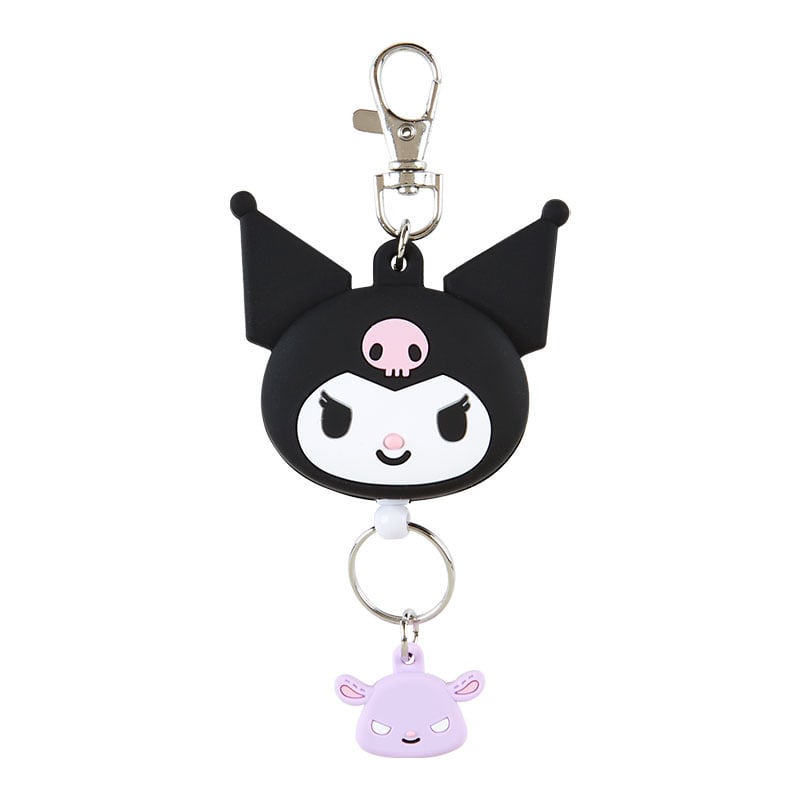 Kuromi badge reel attached to a lanyard with subway card in downtown setting