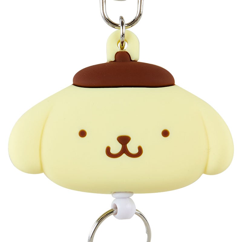 Close-up of the Pompompurin badge reel with retractable ID holder attached to keys