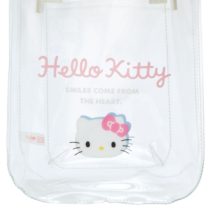 Side angle featuring the detachable shoulder strap of the clear mini tote bag