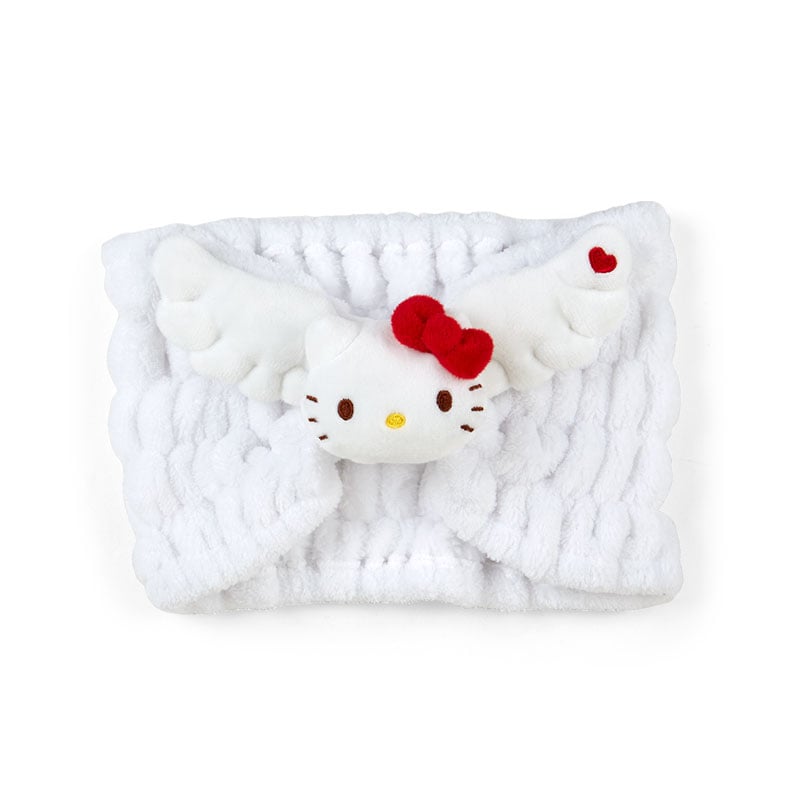 Close-up of Hello Kitty angel wings plush headband with embroidered details