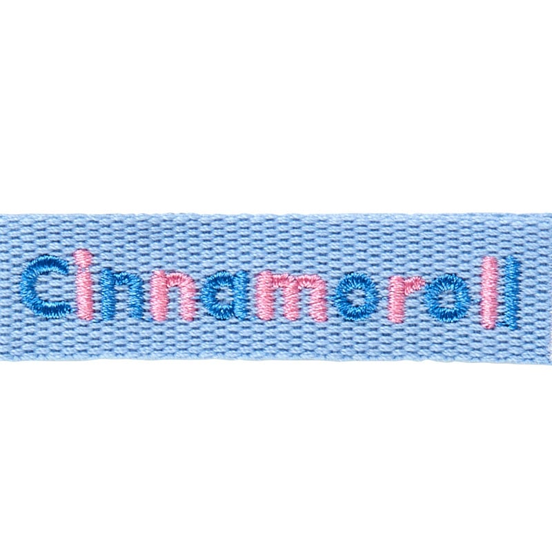 Side view showing soft mascot texture and push clasp of the keychain