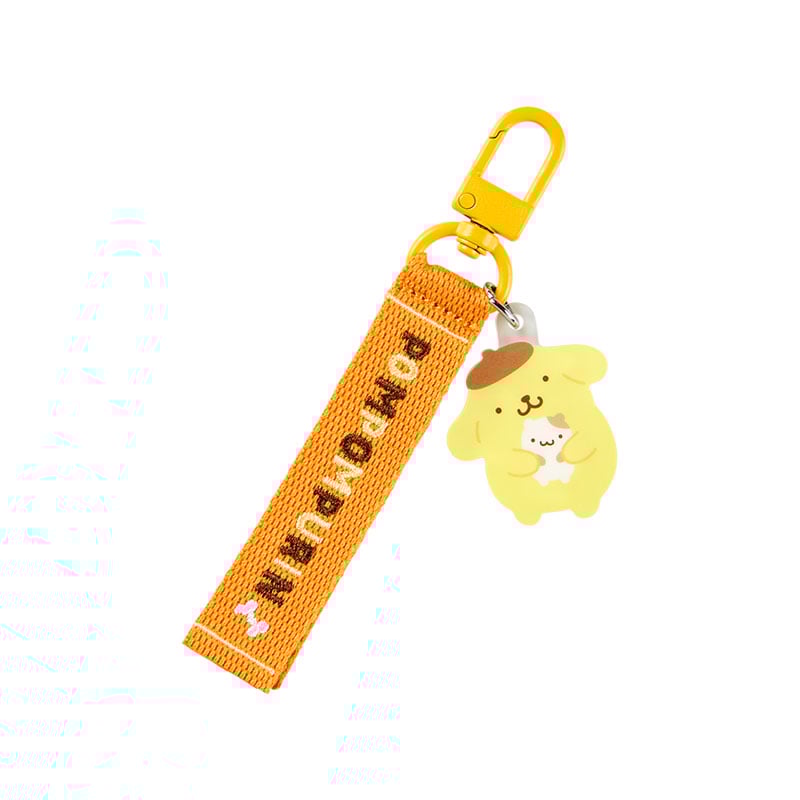 Pompompurin mascot keychain with embroidered logo, hanging on a bag