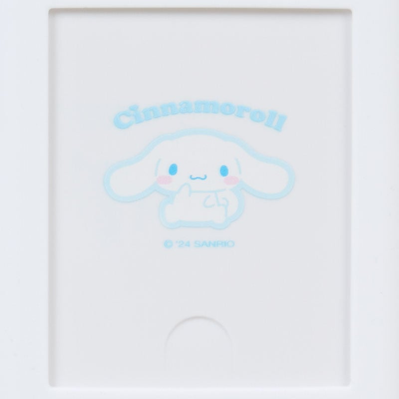 Cinnamoroll badge holder clipped to a lanyard against pastel background