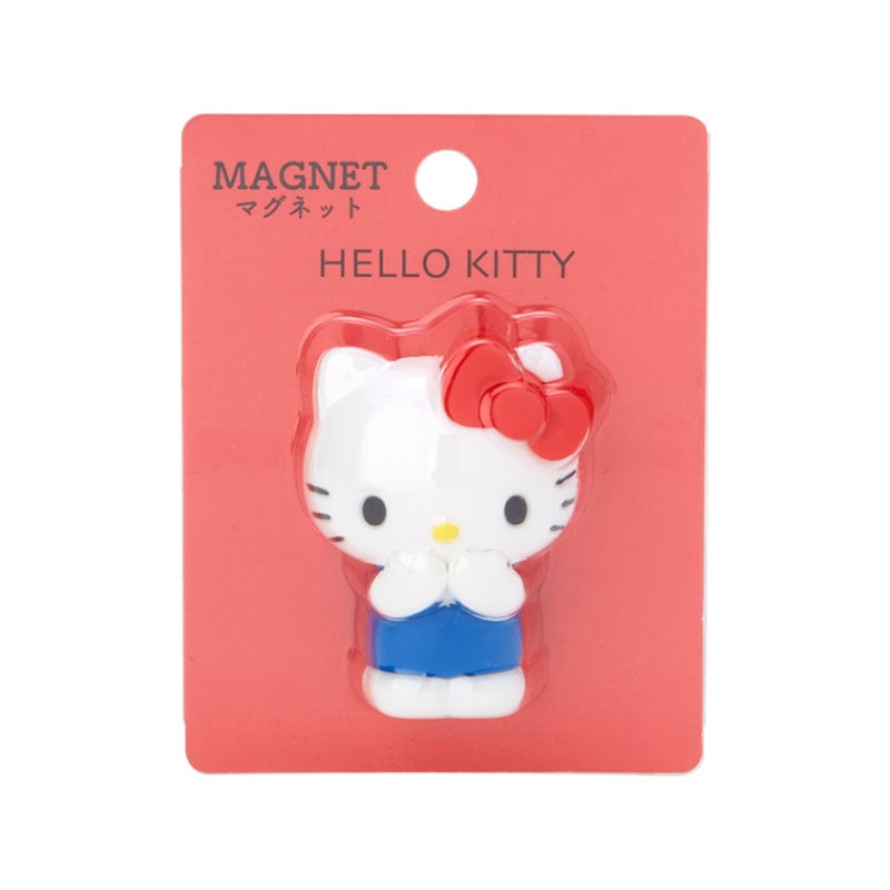 Hello Kitty mini mascot fridge magnet on a kitchen refrigerator.