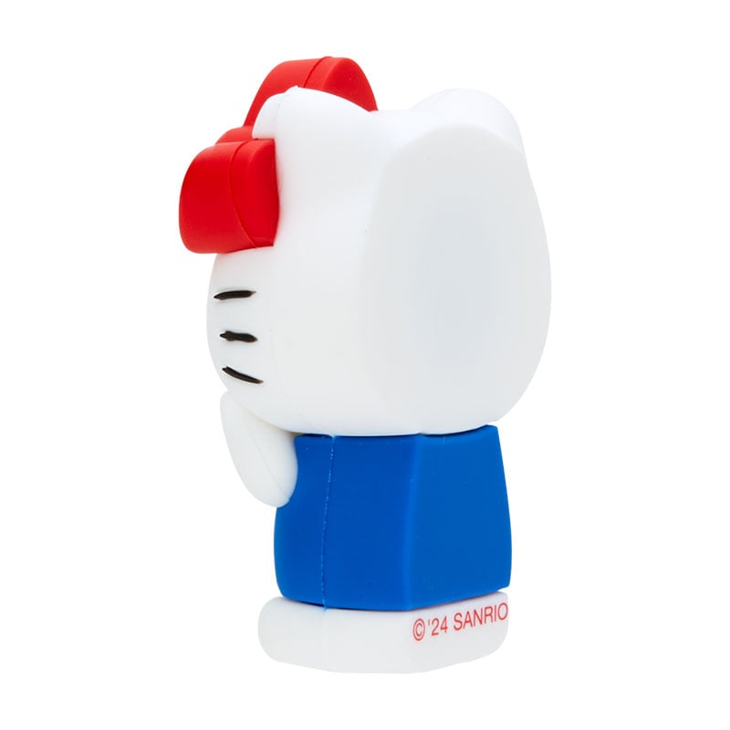 Hello Kitty mini mascot fridge magnet on a kitchen refrigerator.