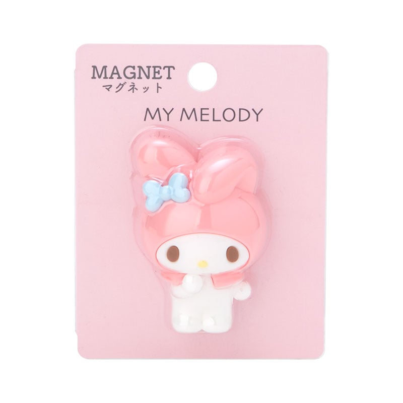 My Melody magnet on a modern fridge beside a postcard and polaroid photo.