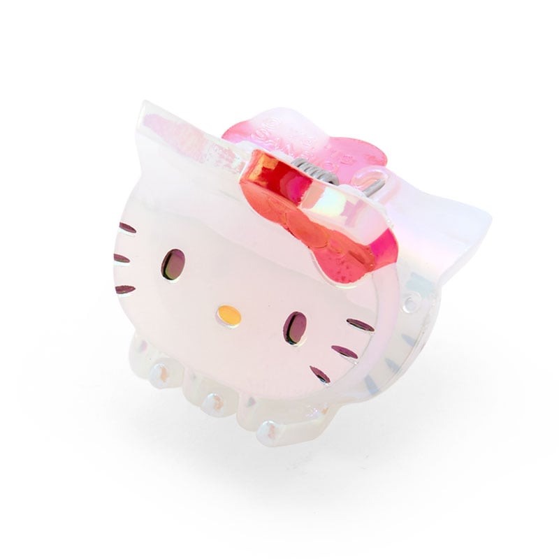 Iridescent Hello Kitty mini hair clips in a row showing their shiny surface