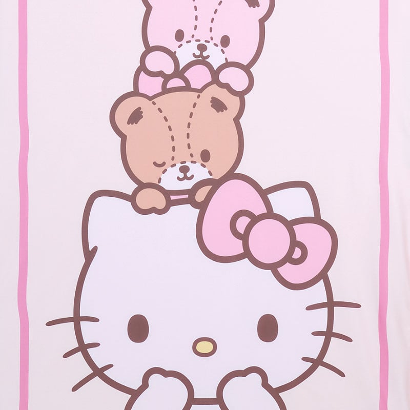 Person relaxing outdoors with lightweight Hello Kitty blanket on picnic blanket