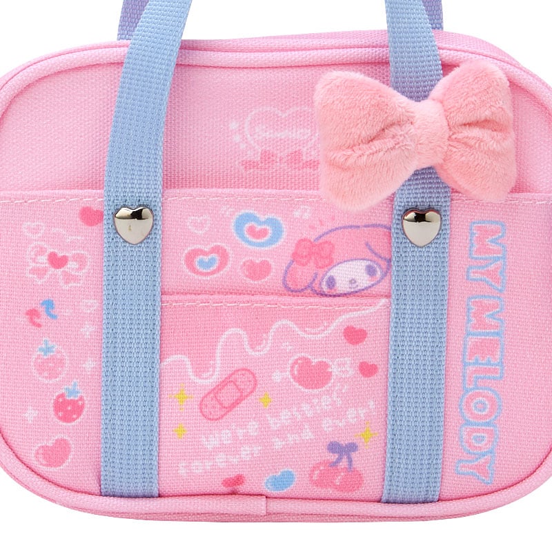 My Melody mini handbag displayed with school supplies showing its compact size.