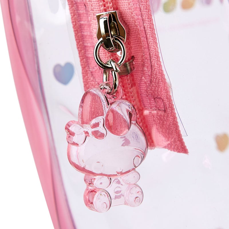 Side view of gummy candy-themed zipper pouch on a desk with cosmetics