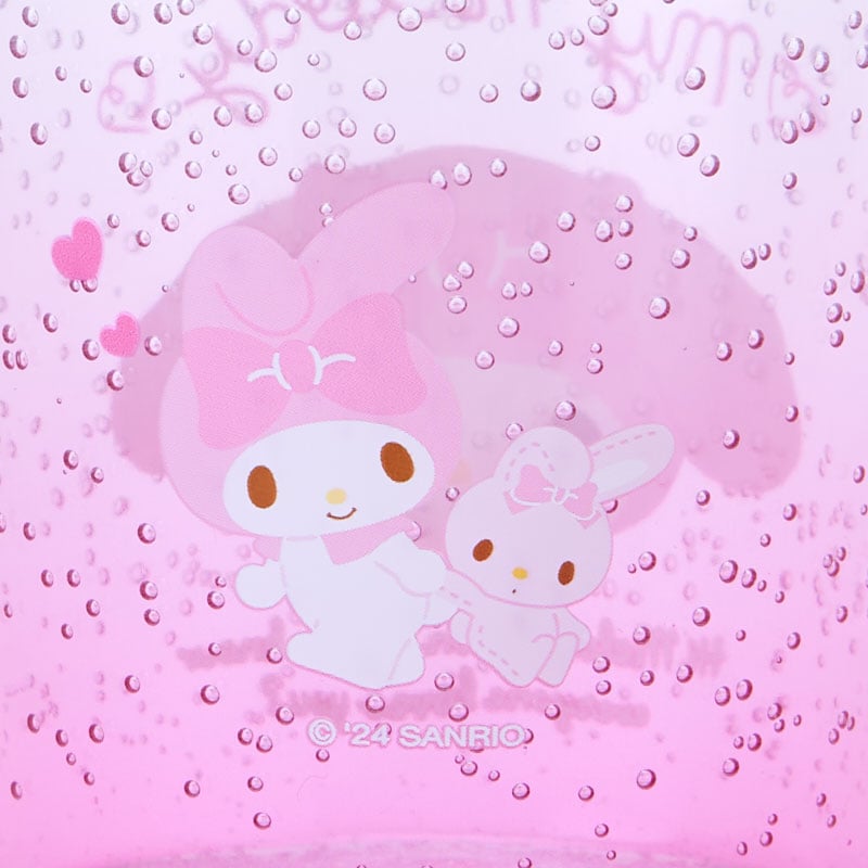 My Melody cup front view on a wooden table with water inside