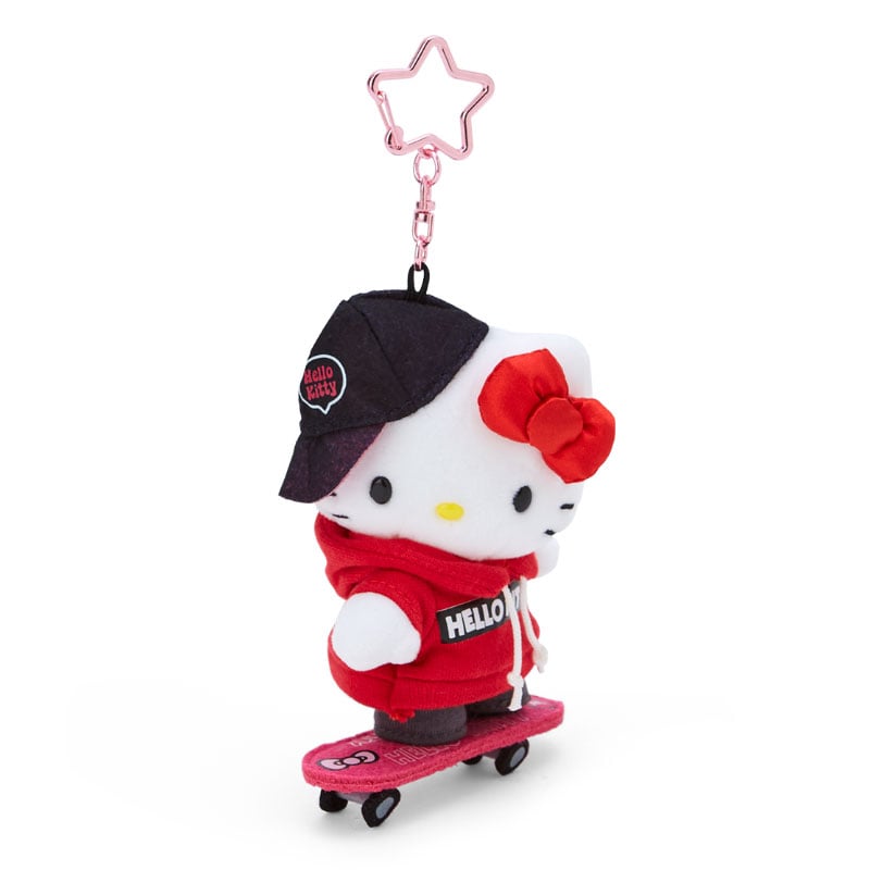 Front view of mocha Hello Kitty plush keychain with star carabiner and skateboard.